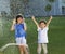 Excited kids has fun playing in water fountain