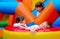 Excited kids having fun on inflatable attraction playground