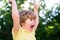 Excited kids. Portrait of adorable little boy on green background park in nature. Wow look. Portrait of amazed cute
