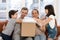 Excited kids unpack cardboard box shopping with parents online