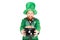 Excited leprechaun in green suit holding pot of gold