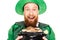 Excited leprechaun holding pot of gold