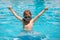 Excited little child boy in sunglasses in pool in summer day. Child boy swim in swimming pool.