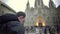 Excited male tourist taking picture of Gothic cathedral, travel impressions