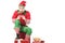 excited man in christmas elf costume sitting on pile of presents and playing video game isolated