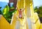 Excited man having fun on water slide in tropical aqua park