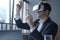 Excited man office worker wearing vr goggles touching objects with hands in digital world