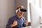 Excited man in VR headset celebrating victory in office
