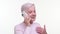 Excited Mature Caucasian Woman Talking on Phone Against White Background