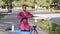 Excited millennial beautiful yoga instructor recording vlog on cellphone basic exercise, fitness trainer conducts online