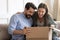 Excited millennial couple unpack internet order parcel