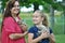 Excited mother & child cuddle new pet kittens