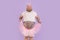 Excited obese mature man wearing fairy suit holds chiffon skirt on purple background