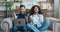 Excited overjoyed interracial couple look at laptop screen feel winners surprised by lottery betting winning bid