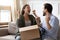 Excited overjoyed man and woman unpacking awaited parcel together