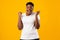 Excited Overweight African Lady Shaking Fists Shouting Over Yellow Background