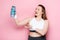 Excited overweight girl holding sports bottle