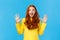 Excited, overwhelmed happy redhead cute girl in yellow sweater, screaming from joy telling about christmas gifts