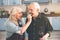 Excited pensioners tasting healthy vegetable in cook room