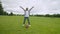 Excited school age black boy celebrating touchdown on field