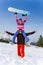 Excited snowboarder with girl on his shoulders