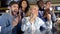 Excited sport fans celebrating team goal, clapping hands together, leisure