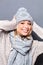 Excited stylish girl with winter hat and scarf feeling