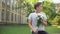 Excited teen boy with bouquet of flowers waiting for girlfriend, anticipation