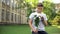 Excited teen boy with bouquet of flowers waiting for girlfriend, anticipation