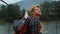 Excited traveler enjoy landscape mountains. Closeup joyful hiker walk on bridge.