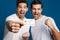 Excited two guys making winner gesture while showing credit card