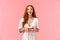 Excited, upbeat happy alluring redhead woman in white dress, holding plate with delicious birthday cake, smiling and