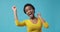 Excited woman celebrating success with raised fist