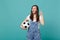 Excited woman football fan cheer up support favorite team with soccer ball hold index finger up with great new idea