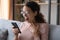 Excited woman reading unexpected good message, looking at phone screen