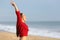 Excited woman screaming on the beach