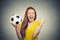 Excited woman screaming celebrating football team success