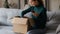 Excited woman unbox package shopping online on cell