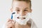 Excited Young Boy Shaving with Plastic Razor