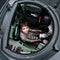 Excited young boy sitting in a tank