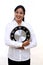 Excited young business woman holding clock in hands