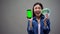 Excited young lady holding smartphone and euro banknotes, online lottery winner