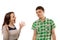 Excited young woman gesturing at her boyfriend