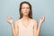 Excited young woman in glasses feel euphoric in studio