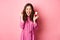 Excited young woman showing engagement ring and celebrating getting married, smiling happy, talking about wedding day