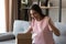 Excited young woman unbox package with internet order