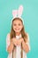 Excitement of easter season. Cute little girl wearing bunny ears headband. Fashion accessory for easter costume party