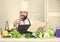 Excitement. Vegetarian salad with fresh vegetables. Healthy food cooking. Mature hipster with beard. bearded man. chef