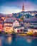 Exciting evening cityscape of Bern town with Cathedral of Bern on background. Spectacular autumn sunset on Switzerland, Aare River