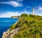 Exciting morning view of Cape Lefkatas with old lighthouse. Colorful spring seascape of Ionian Sea. Beautiful outdoor scene of